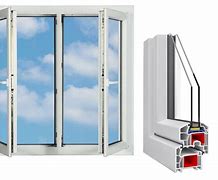 Technician installing a white PVC window frame in a modern home interior with natural light and clean surroundings, focused and professional atmosphere